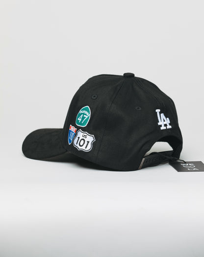 Black cap with various logos on a white background